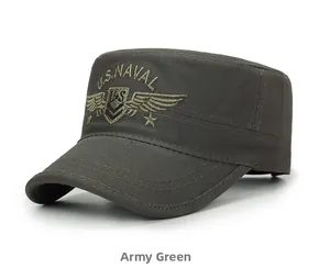 Detailed close-up of U.S. NAVAL shield embroidery on the green cotton cadet cap