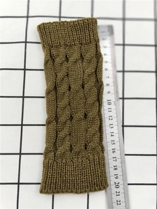 Close-up of brown cable knit arm warmer measuring approximately 20.5cm in length