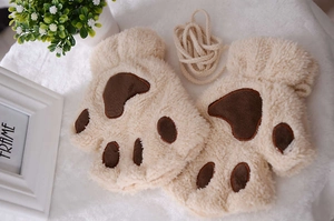 Detail of plush cat paw fingerless gloves in beige with thick faux fur and neck strap