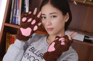 Close-up of brown plush cat paw fingerless gloves with pink embroidered paw pads