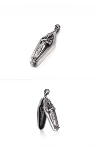Detailed view of vintage stainless steel Pharaoh coffin pendant with opening mechanism