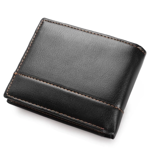 Detail of black leather men's wallet with fine texture and brown contrast stitching