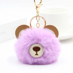 Cute purple faux fur bear keychain with brown leather ears and gold metal hardware hook