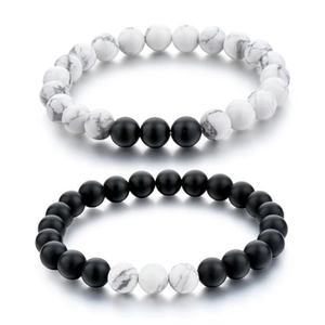 Macro detail of 8mm matte black and white turquoise bead couple distance bracelets