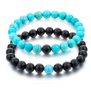 Set of 8mm matte black and white turquoise beaded bracelets for couples on white backdrop