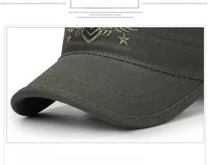 Detail of army style flat top cap featuring reinforced brim and gold star embroidery