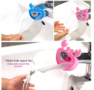 Blue and pink crab-shaped faucet extenders showing water flow for kids' hand washing