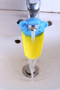 Blue bear faucet extender showing water flow for easier children's hand washing