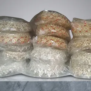 Detailed view of stacked vintage crystal bridal crowns in gold and silver finish