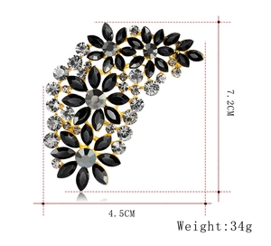 Detail view of flower brooch showing dimensions 7.2cm by 4.5cm and weight of 34g