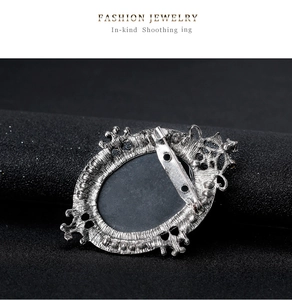Rear view of vintage silver brooch showing horizontal pin closure and hollow metalwork