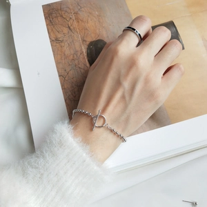Detail of silver S925 beaded bracelet with OT toggle clasp and matching minimalist ring