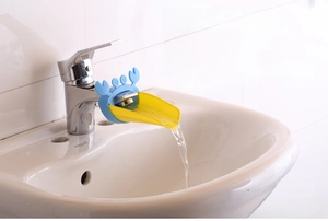 Blue and yellow crab faucet extender showing water flow for kids hand washing