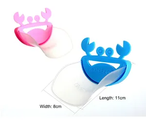 Detail view of pink and blue crab faucet extenders for kids measuring 11cm by 8cm