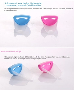 Macro view of blue and pink crab-shaped water faucet extenders for toddler hand washing