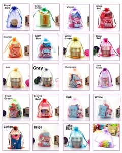 Macro detail of multicolored organza drawstring gift pouches showing texture and cord design