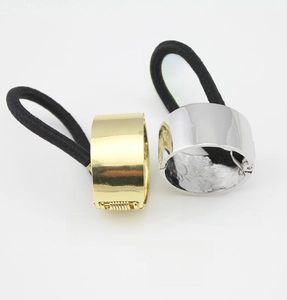 Close-up of gold and silver metallic ponytail cuff clips with high elasticity bands