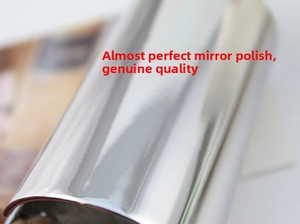 Detail of high-gloss mirror-polished surface on a metal cylinder hair ponytail cuff