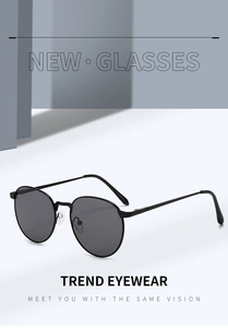 Detail of retro oval metal frame sunglasses with spring hinges and soft silicone nose pads