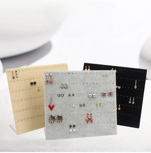 L-shaped velvet and linen earring display stands in beige, grey, and black
