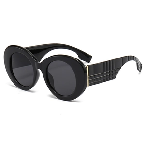 Lunettes de soleil rondes rétro avec monture noire et branches à texture de grille