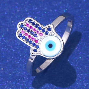 Macro shot of Hamsa Hand ring with Evil Eye center and blue zircon micro-paving