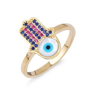 Macro shot of Hamsa Hand ring with colorful zircons and Evil Eye shell detail