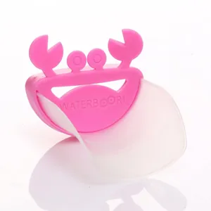 Pink crab-shaped faucet extender for children's hand washing with white silicone guide