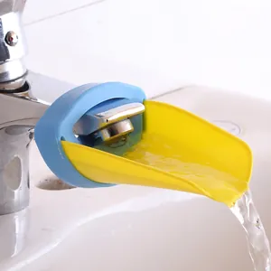 Blue and yellow crab faucet extender for kids shown on bathroom sink with flowing water
