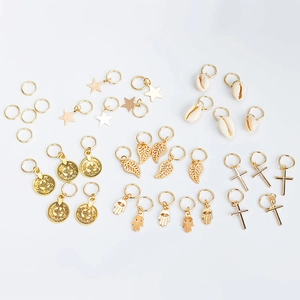 Boho golden hair ring set with star, leaf, and shell charms for braided hairstyles