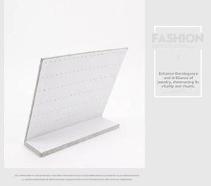 L-shaped jewelry display board with white perforated surface and grey textured border