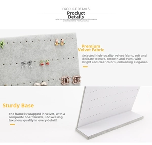 Close-up of L-shaped gray velvet earring display stand showing hole details and base