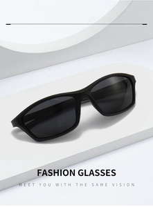 Detailed view of black rectangular sports sunglasses on a white geometric platform