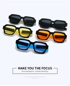 Flat lay of retro square sunglasses featuring colorful lenses and thick black frames