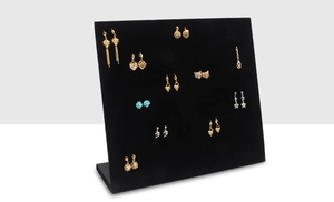 Detailed side view of L-shaped black velvet earring display stand with multi-hole design