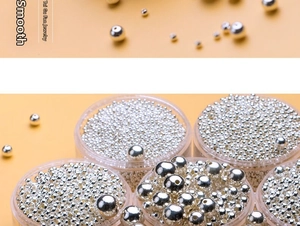 Macro shot of assorted size S925 sterling silver smooth round beads for DIY jewelry making