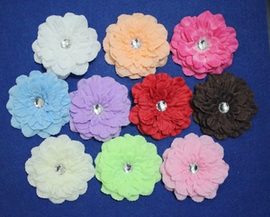 Detailed top view of colorful velvet rose hair combs with sparkling rhinestone centers