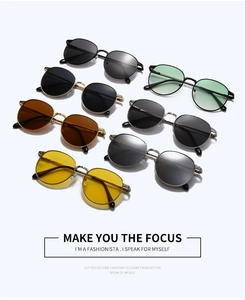 Detailed close-up showing oval metal sunglasses in multiple colors and finishes