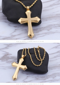 Detailed view of a 3D gold stainless steel cross pendant with twisted rope chain
