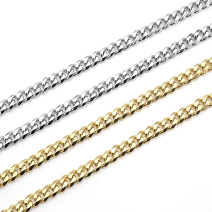 Classic stainless steel Cuban link necklaces in gold and silver finish on white background