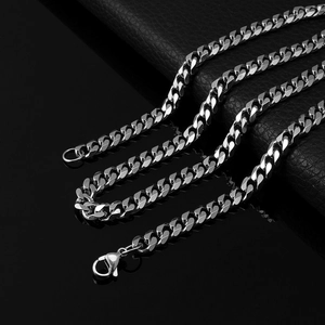 Detail shot of silver stainless steel Cuban link chain with a secure lobster clasp