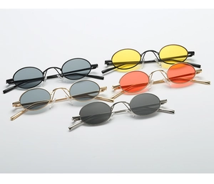 Close-up of retro oval sunglasses with metal frames in various lens color options