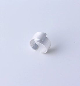 Detailed view of wide brushed silver S925 ring with matte texture and open band