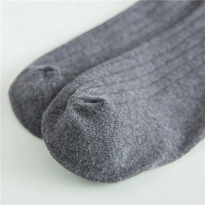 Close-up of dark grey cotton crew sock showing soft ribbed texture and knit details