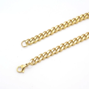 Polished gold stainless steel Cuban link necklace with lobster clasp on white background