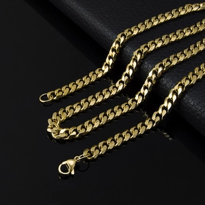 S-shaped golden stainless steel Cuban link chain necklace with lobster clasp on dark base