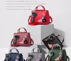 Group display of chic crossbody bags with 3D floral accents and fuzzy pompom charms