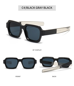 Detail view of bold black square frame sunglasses with dark gray lenses and metal hinge