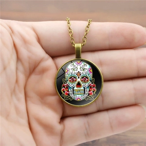 Mexican sugar skull necklace with glass gem pendant and vintage bronze chain