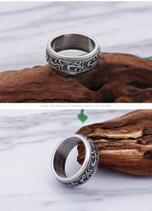 Macro detail of men's vintage titanium steel ring with embossed floral relief patterns